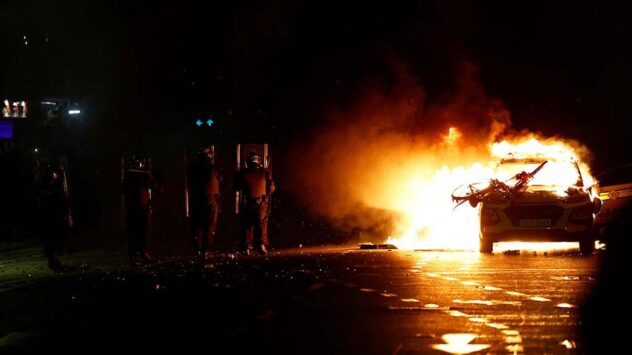 Rioters clash with police, torch car after knife attack in Dublin
