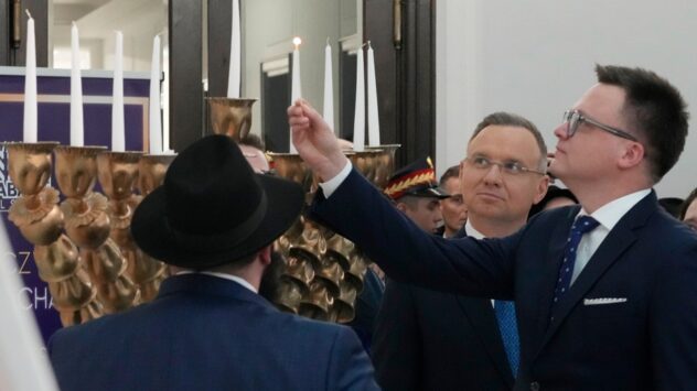 Polish leaders celebrate Hanukkah after menorah extinguished by far-right lawmaker