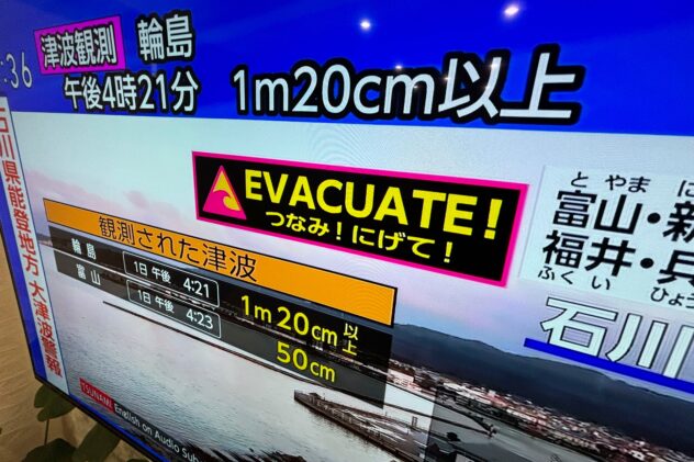 Japan lowers tsunami warning after a series of earthquakes but tells people to stay away from coast