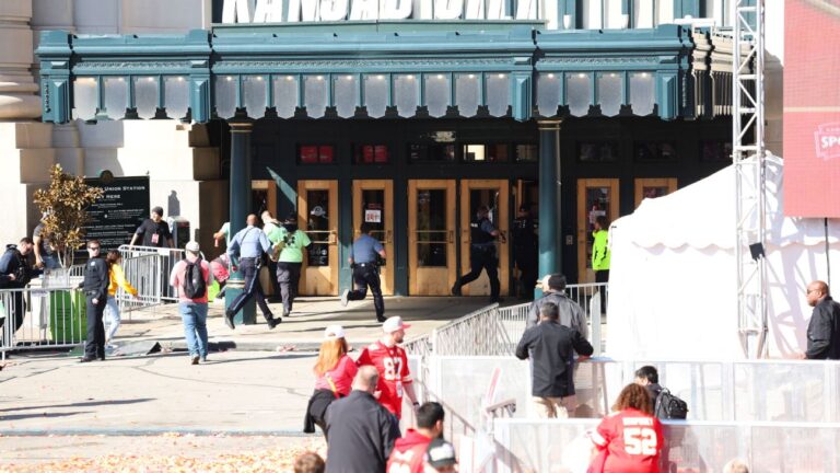 2 adults charged with murder in parade shooting