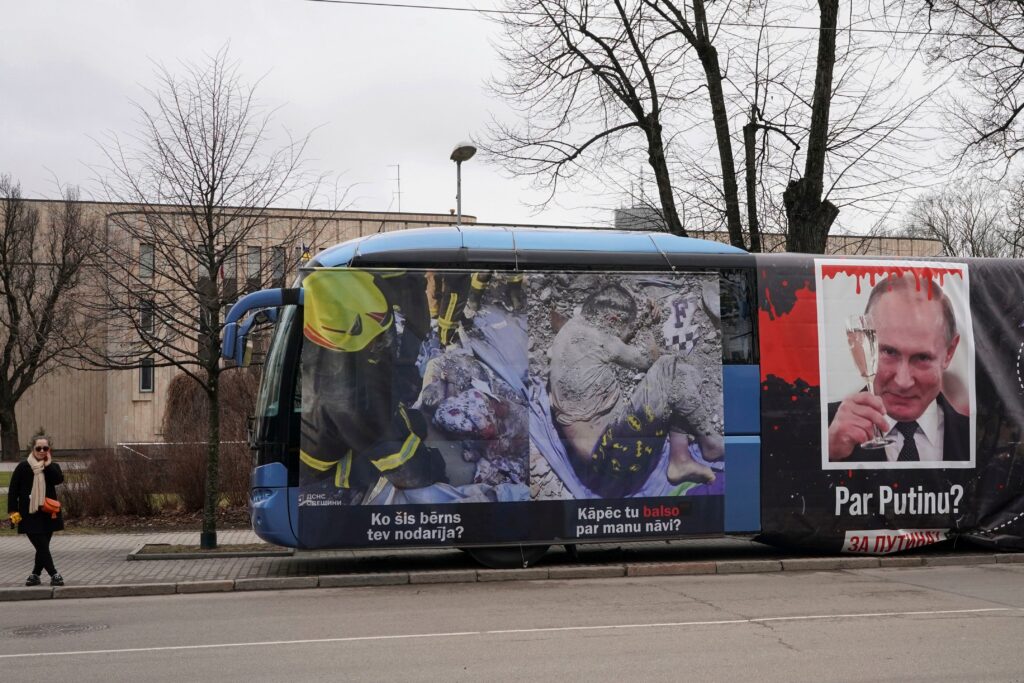 Russians crowd polling stations in apparent protest as Putin is set to extend his rule