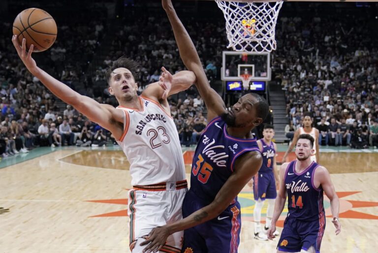 Sochan, Vassell lead Spurs past Suns 104-102 as injured Wembanyama watches from sidelines