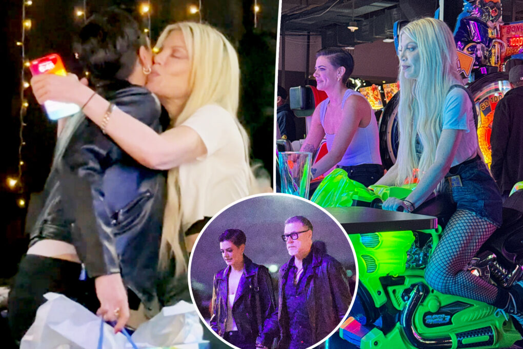 Tori Spelling gives ex Dean McDermott’s girlfriend, Lily Calo, a hug and kiss during amicable arcade outing