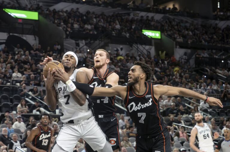 Short-handed Spurs topple injury-depleted Pistons 123-95 to close out season