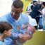 Introducing Rezon! Kyle Walker brings his baby boy onto the pitch as wife Annie Kilner arrives with their four sons to support footballer at Manchester City match