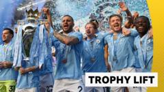 Watch Man City lift Premier League trophy