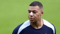 France's Mbappe trains with bandage after nose break
