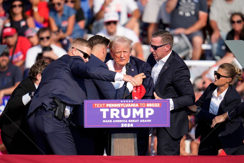The Latest: Trump whisked from stage following apparent assassination attempt