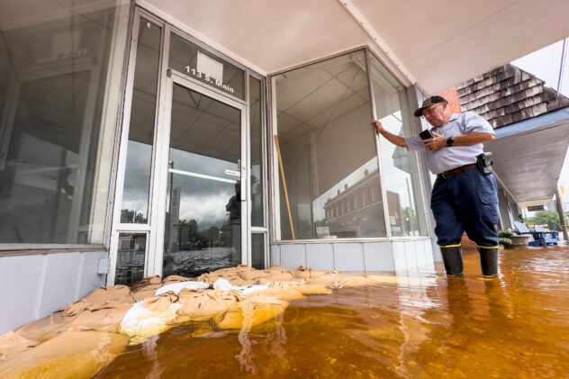 A deadly tornado, flooding rains and swollen rivers plague residents in the path of Debby