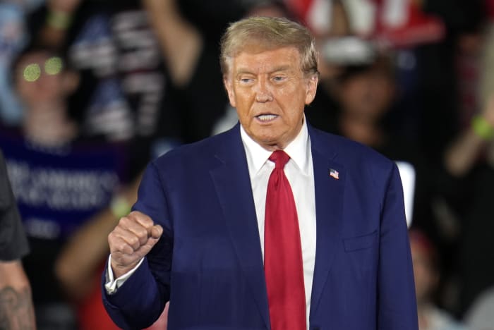 Trump lists his grievances in a Wisconsin speech intended to link Harris to illegal immigration