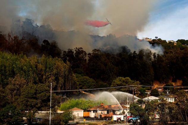 Fast-moving brush fire damages at least 7 homes in neighborhood of Oakland, California