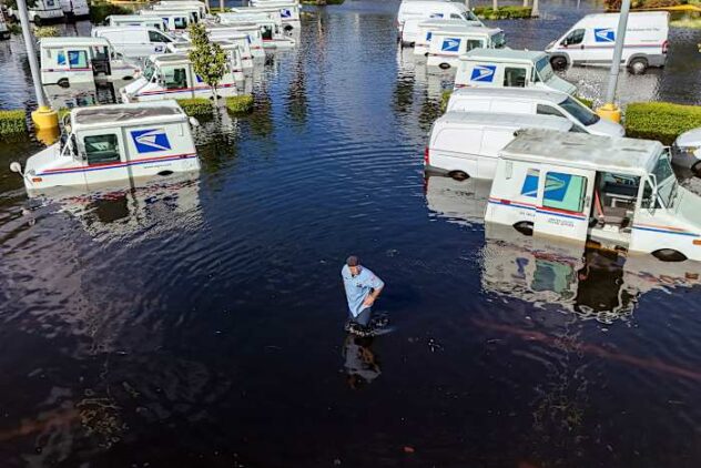 Residents slog through flooded streets, clear debris after Hurricane Milton tore through Florida