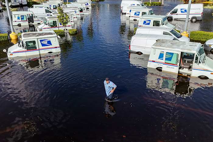 Residents slog through flooded streets, clear debris after Hurricane Milton tore through Florida