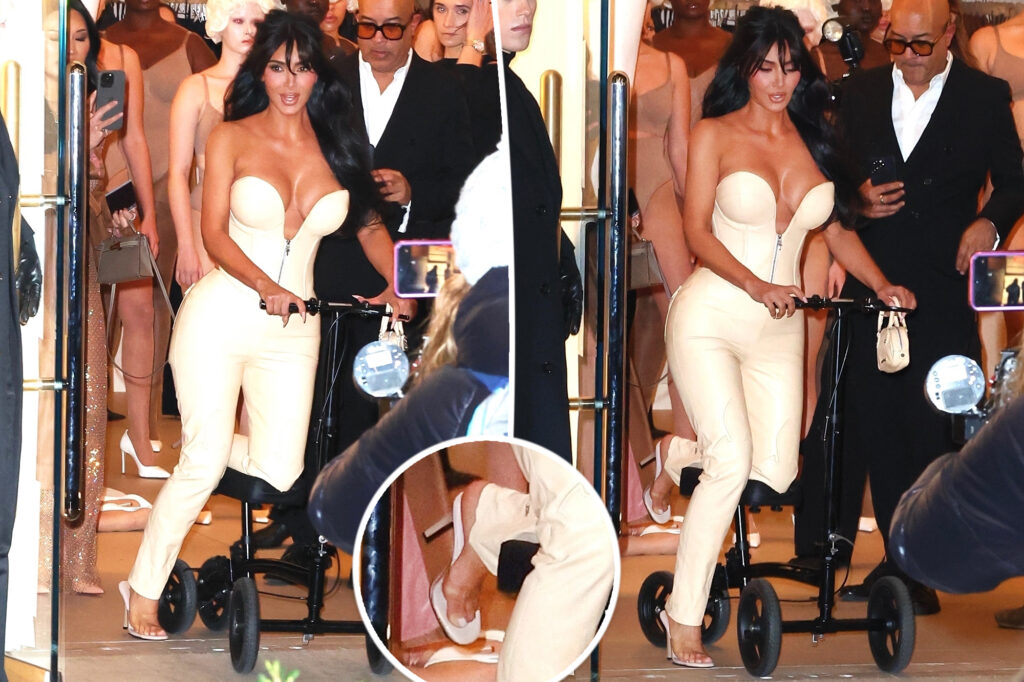 Kim Kardashian scoots on knee walker at Skims store opening as she refuses to ditch heels after breaking foot