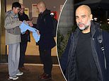 New signing, Pep? Glum Guardiola arrives back at his Manchester city centre apartment after late capitulation in derby against United… but still takes time to sign a fan's shirt