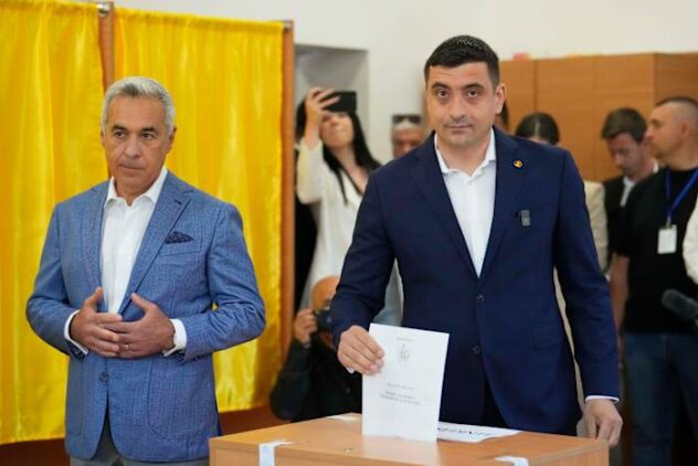 Romanians vote in a presidential redo after voided election sparked deep political crisis
