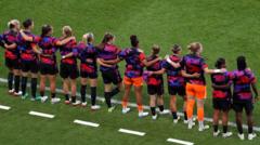 England players and subs stand in support of Carter