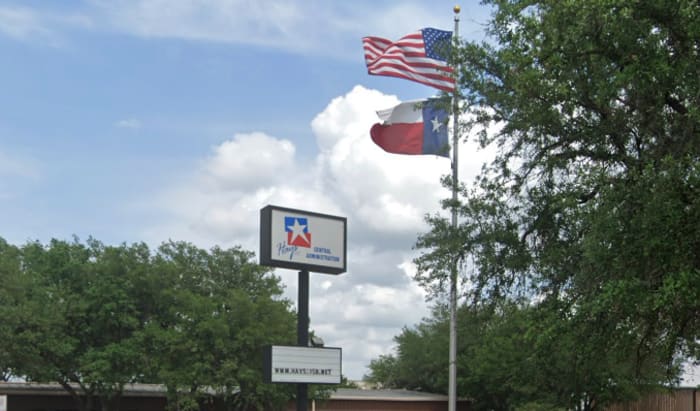 Hays CISD school bus stuck in hole caused by water line break