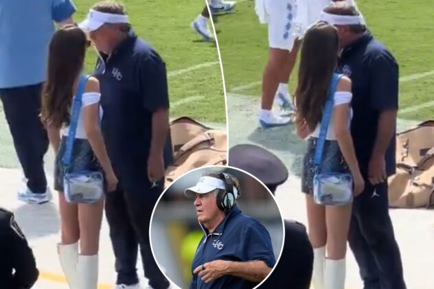 Jordon Hudson chats with Bill Belichick on sideline before North Carolina’s ugly loss to UCF
