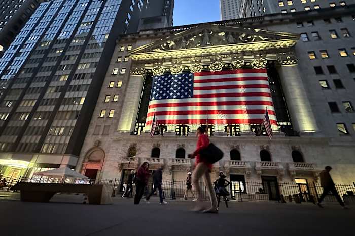 Wall Street edges back from its record heights