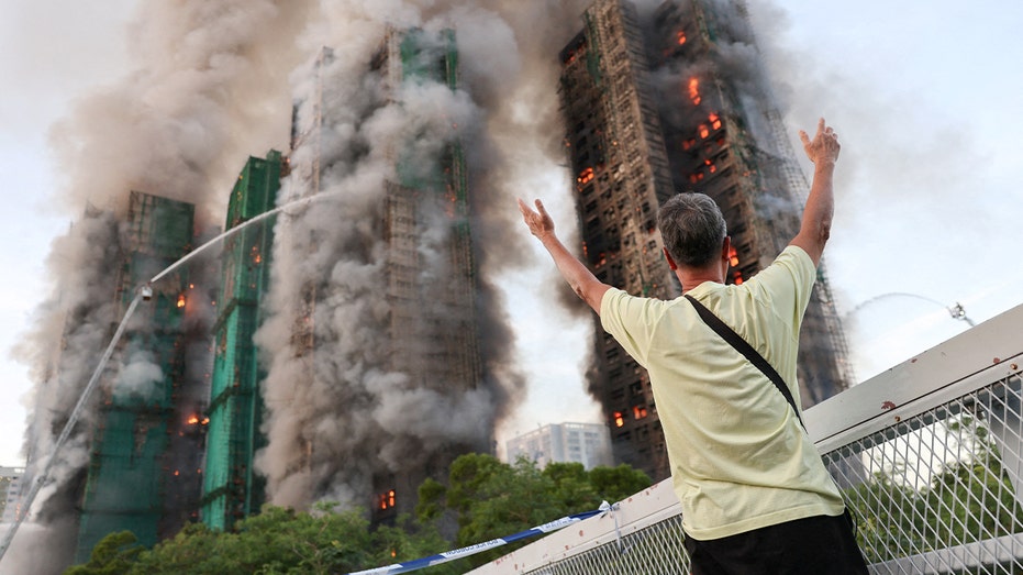 Fire tears through Hong Kong housing complex, killing at least 36 with hundreds missing