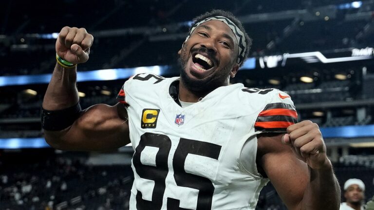 NFL star sacks dating speculation, shares pregame kiss with two-time Olympic gold medalist