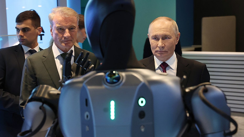 Putin calls dancing Russian robot 'very beautiful' in awkward AI conference moment