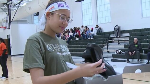 Former Brandeis standout, USC Trojan Rian Forestier donates basketball shoes to middle schoolers