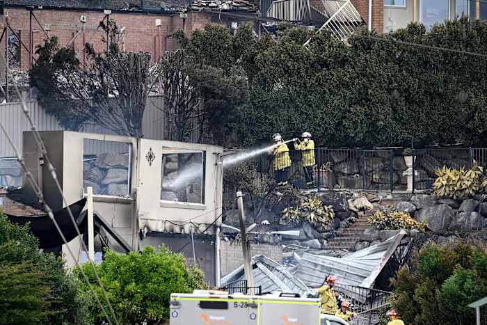 Wildfires destroy 40 homes and kill a firefighter in Australia