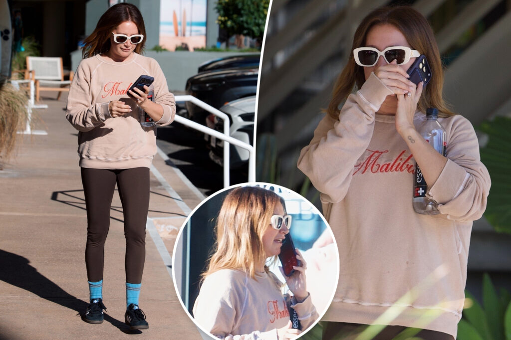See photos of Ashley Tisdale’s somber phone conversation as ‘toxic’ mom group drama continues