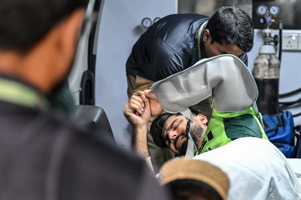 Talat stretchered to hospital after shoulder injury