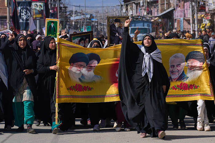 The Latest: Airstrike pounds Iranian pro-government rally as war threatens global economy