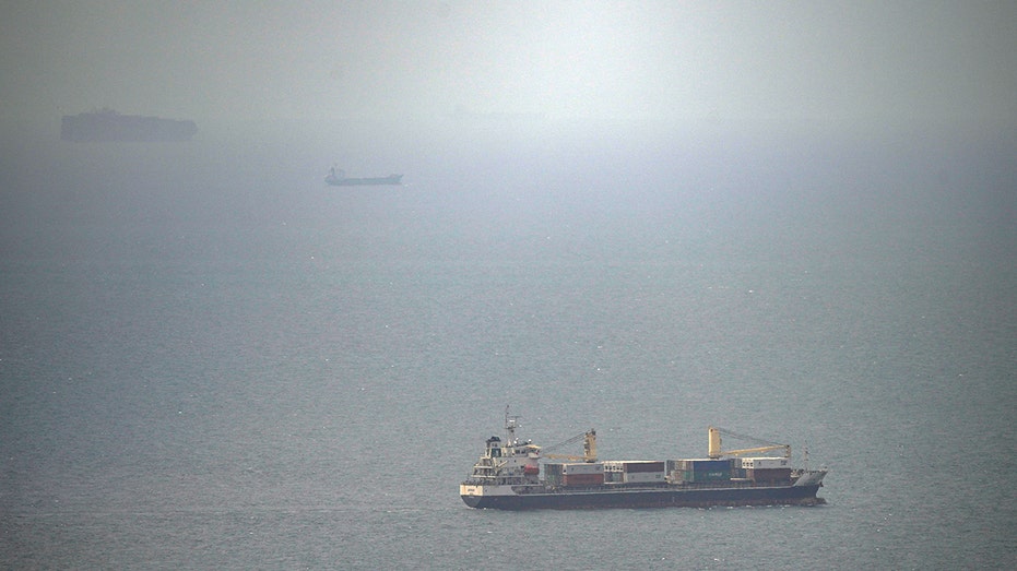 Cargo ship attacked by small craft near Strait of Hormuz, UK maritime agency says