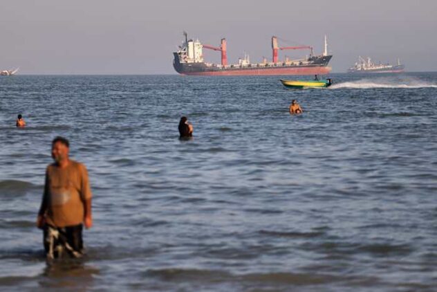 An oil tanker navigates the Strait of Hormuz despite threats from Iran's Revolutionary Guard