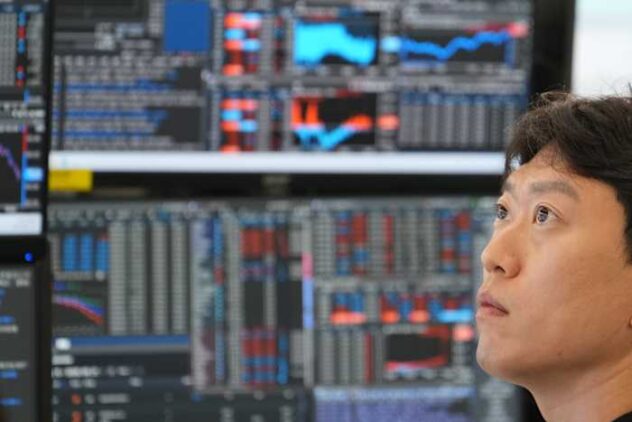 Asian shares are mostly higher and Japan's Nikkei tops 70,000 before BOJ rate hike