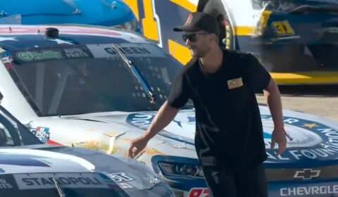 Fan arrested after scaling fences onto NASCAR track, fist-bumping driver during stoppage