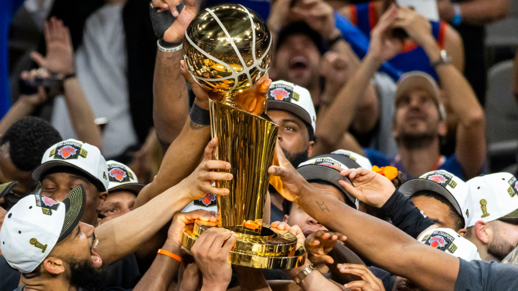 He covered the Knicks for 23 seasons. He watched them win a title from a bar in Florida