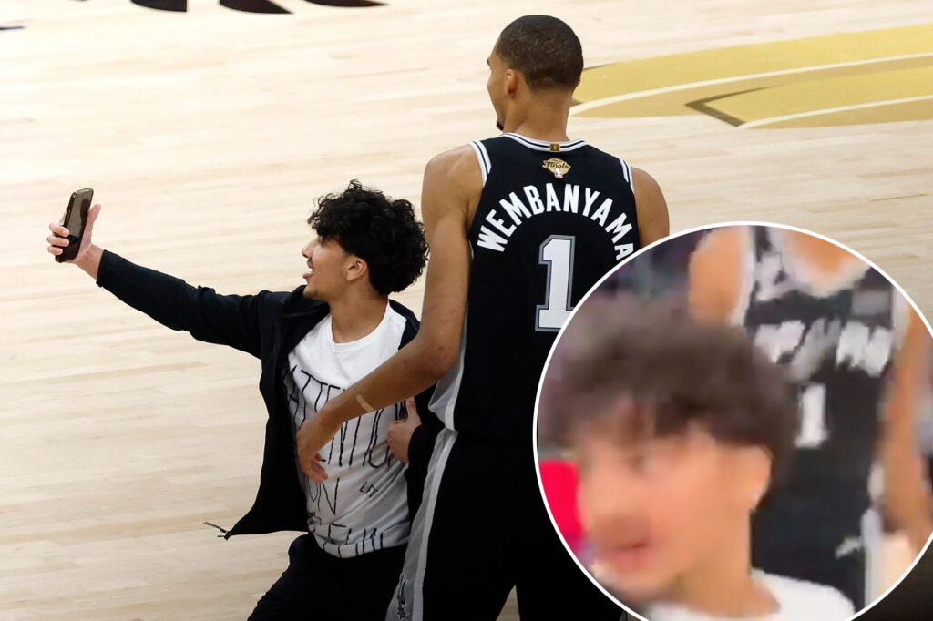 New angle shows fan storming court for selfie with smiling Victor Wembanyama in Knicks-Spurs NBA Finals