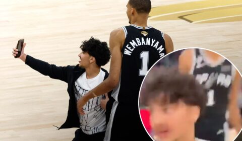 New angle shows fan storming court for selfie with smiling Victor Wembanyama in Knicks-Spurs NBA Finals