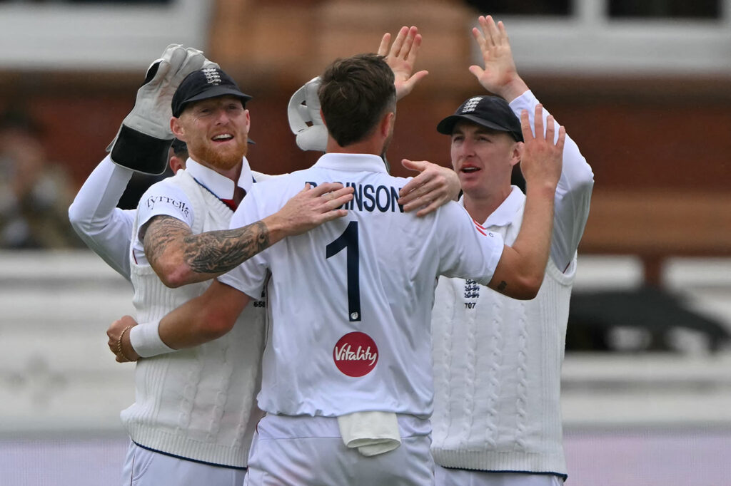 Robinson double-strike moves England closer between showers