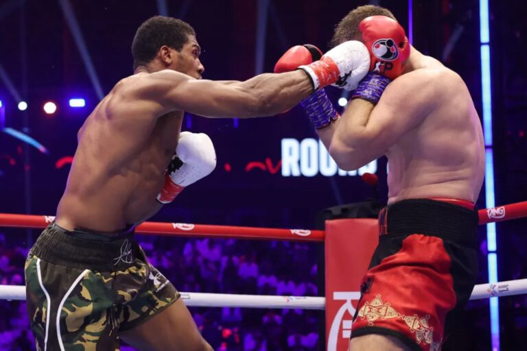 Anthony Joshua survives two knockdowns in win to keep alive all-British fight vs. Tyson Fury