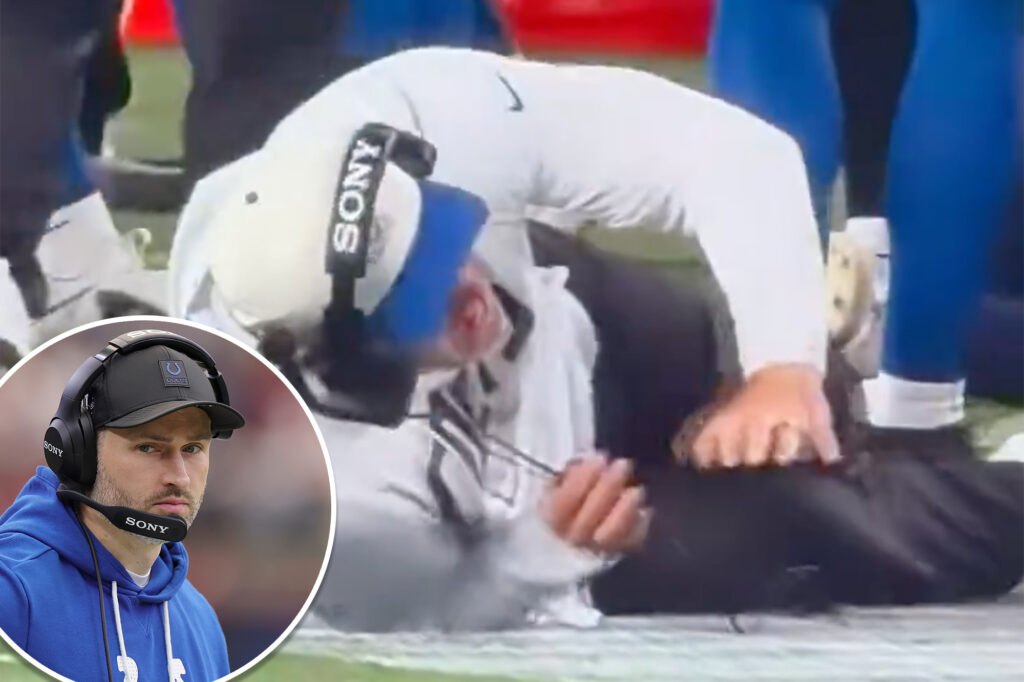Colts coach gets knocked down by own player in painful sideline moment