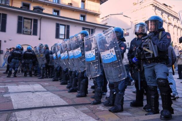 Soldiers guard center of Milan as thousands of protesters march across European cities